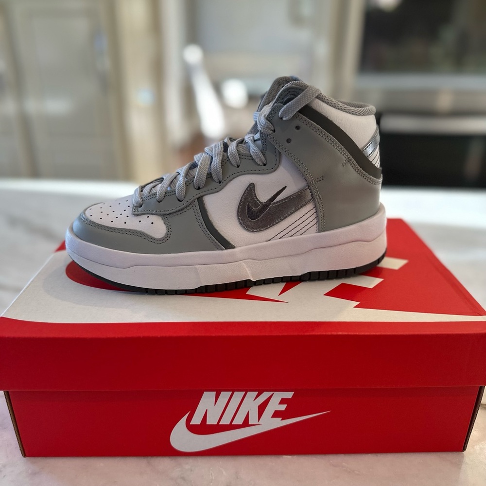Brand new in box never used size 6 women’s Nike Dunks High Up.